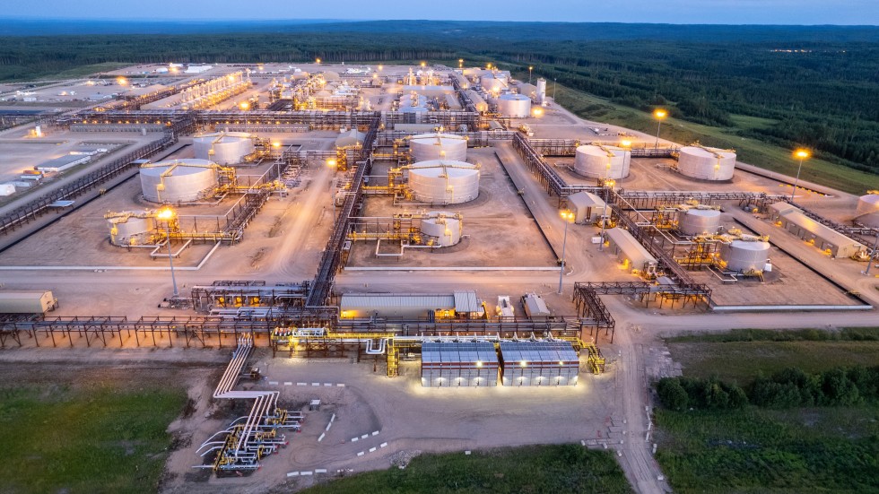 Oil sands processing facility at dusk